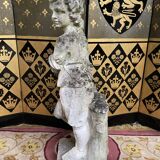 Stone garden statue to the child