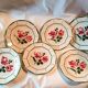 6 flat plates in faience with red rose decoration and green leaves
