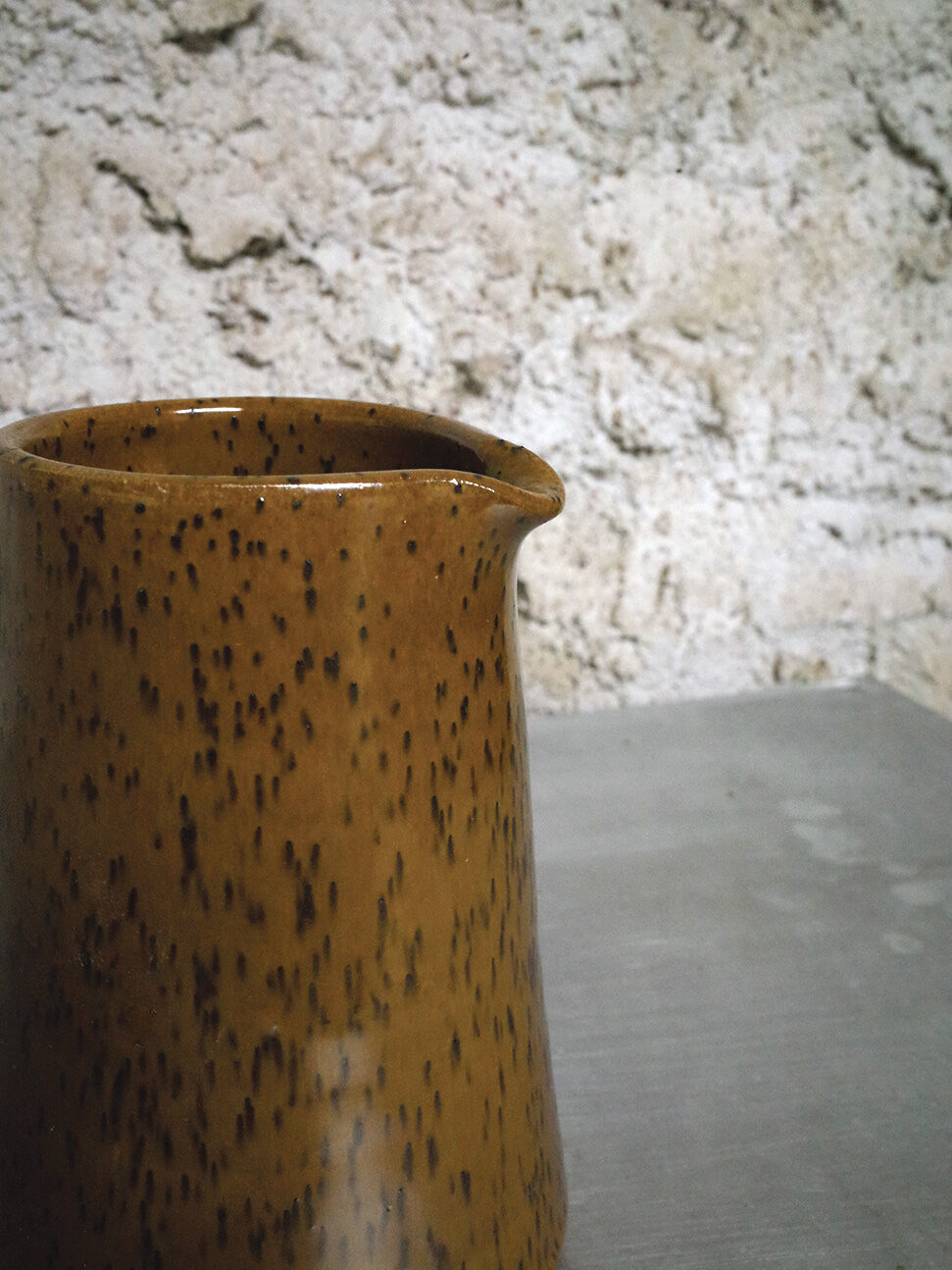 Milk pitcher in spotted sandstone