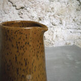 Milk pitcher in spotted sandstone