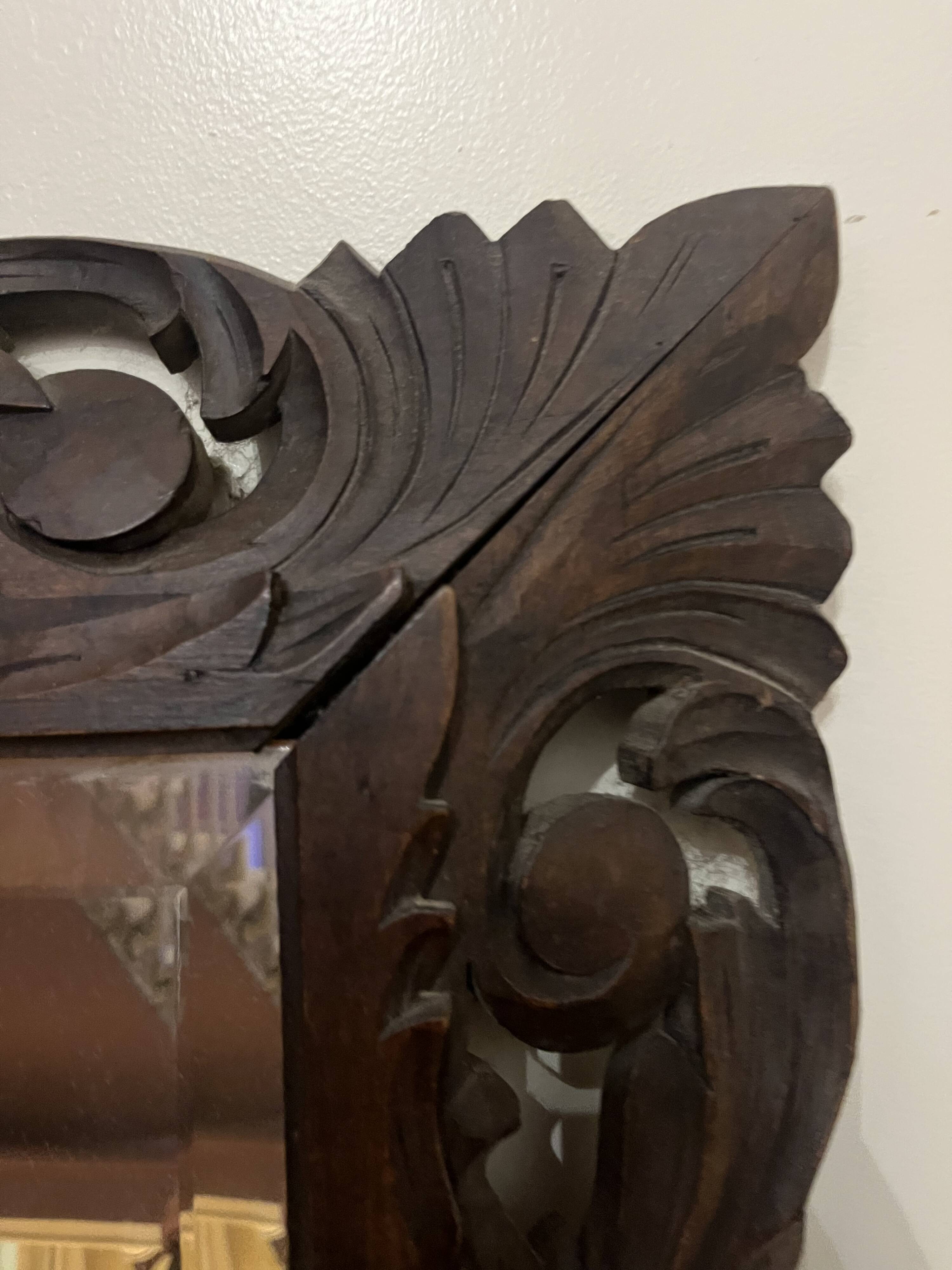 Antique mirror in carved wood