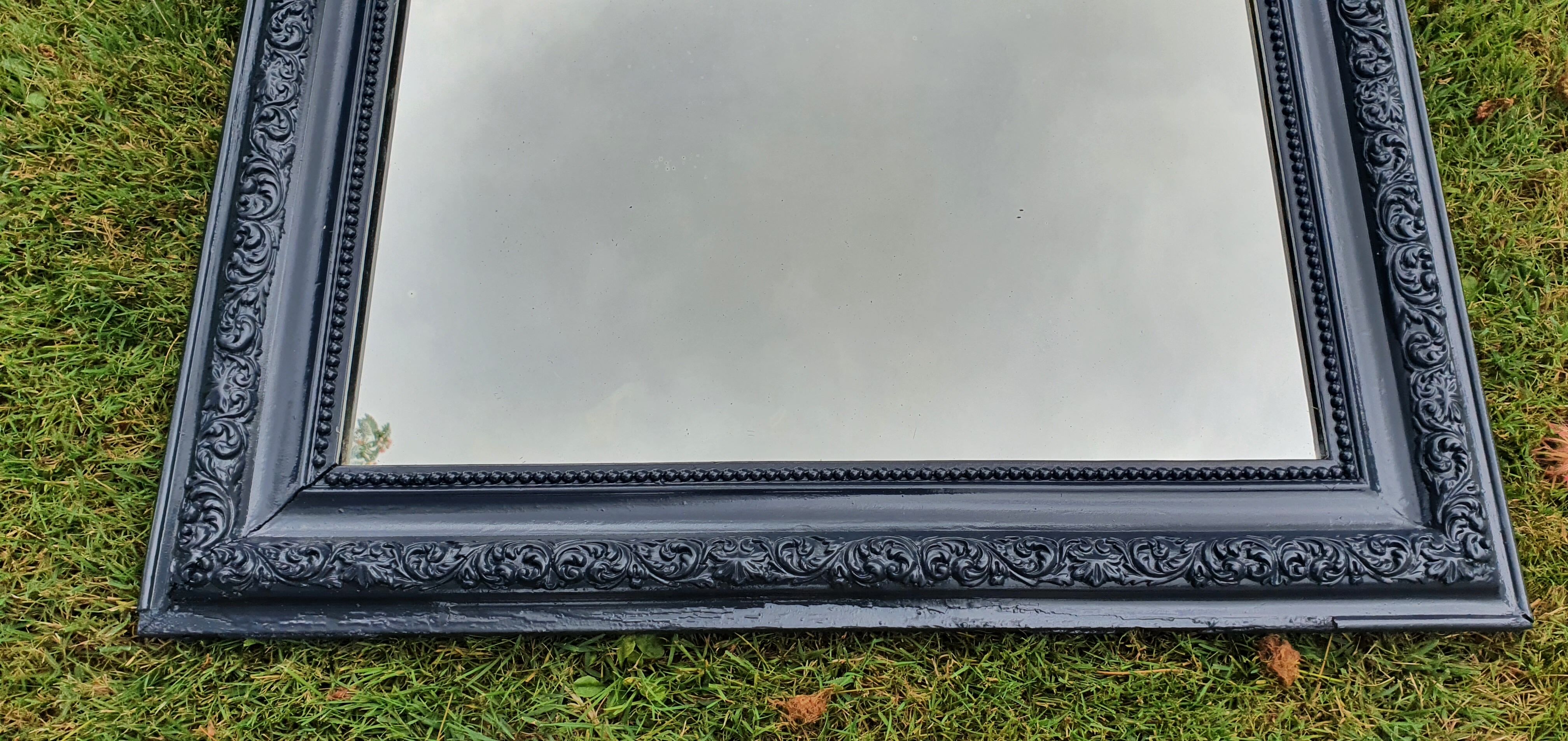 Old mirror Louis Philippe anthracite gray with pricked ice.