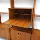 Library with wooden uprights by A.V. Contemporary Furnishings, 1960s.