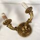 Pair of gilded wooden wall lights with two arms, early 20th century.