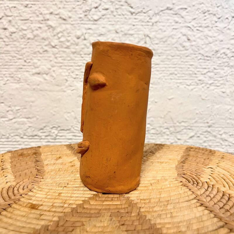 Face terracotta vase