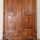 Large antique wooden wardrobe with drawer.