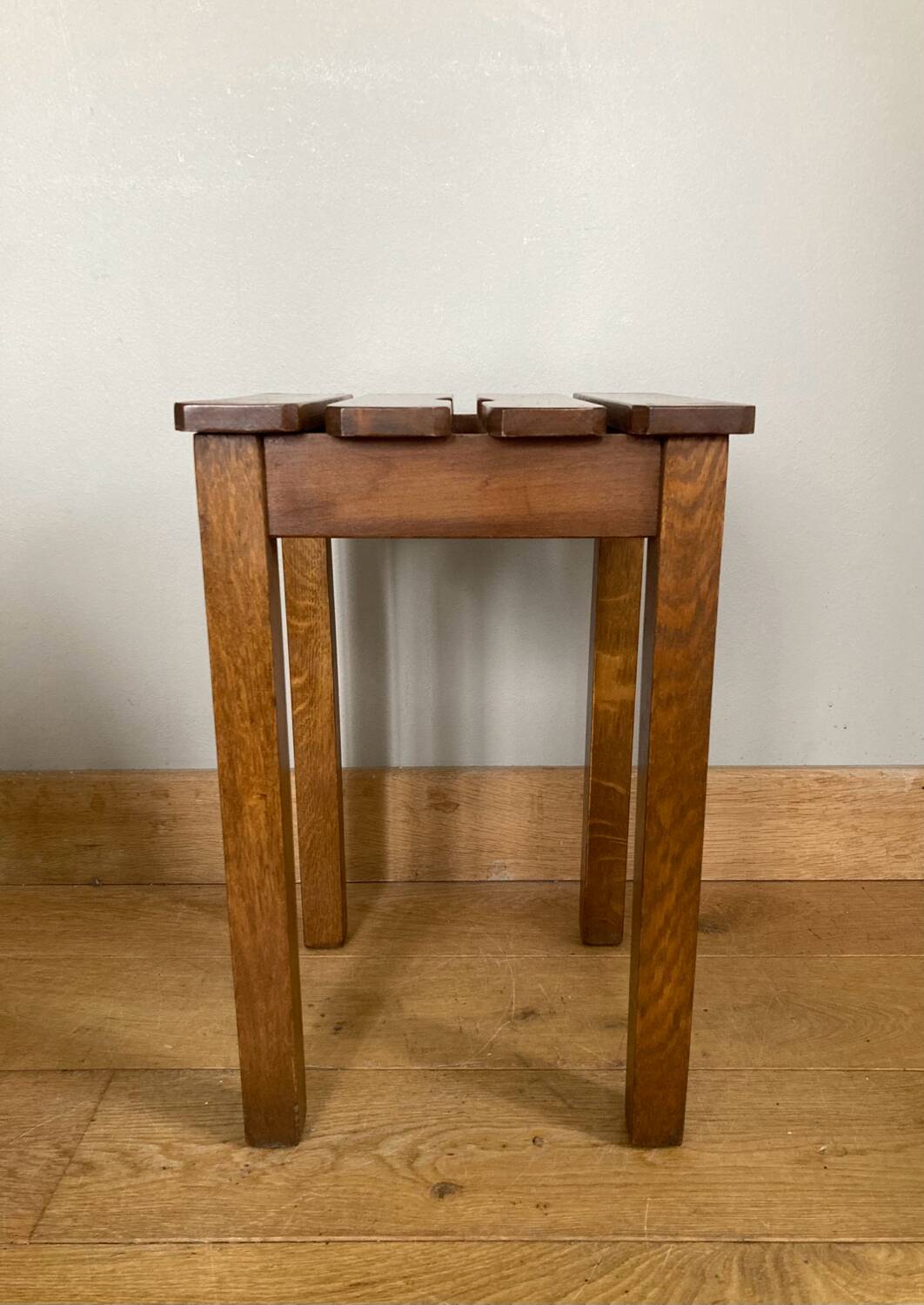 Wooden stool with central grip, quadripod base, 20th century