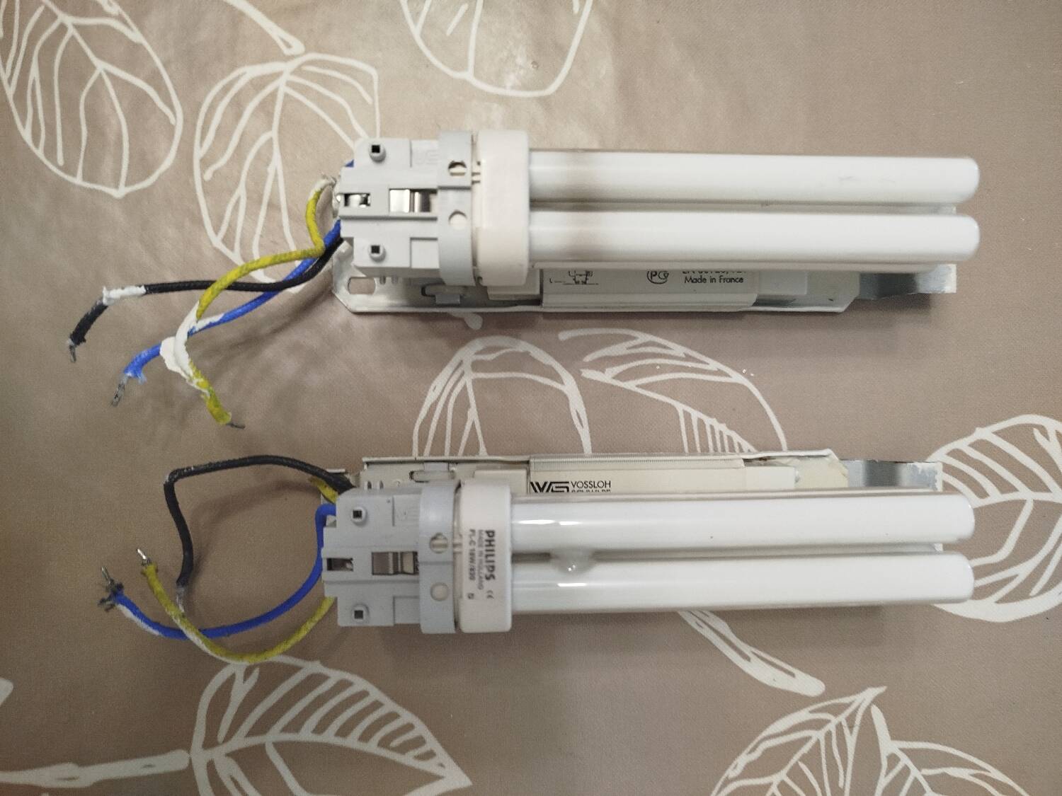 Pair of Art Deco wall sconces in plaster and pressed glass.