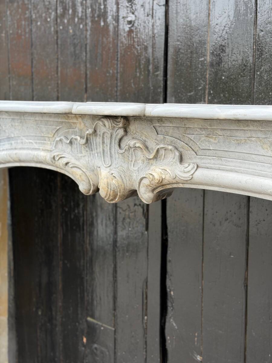 Louis XV fireplace in blue Turquin marble, 18th century.
