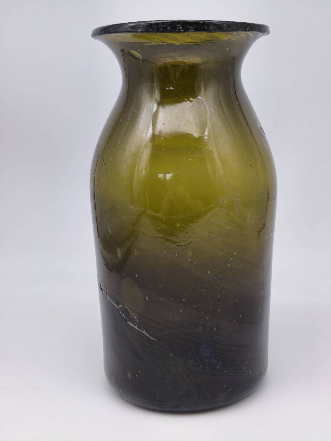 Old olive green blown glass mushroom jar, decorative object.