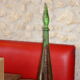 Vintage green faceted glass bottle with its cap 1970