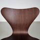 Set of 4 brown oak plywood bar stools by Fritz Hansen Series 7 by Arne Jacobsen.