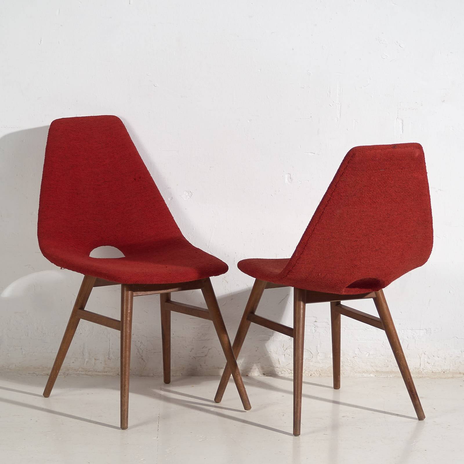 Wooden chairs with burgundy red fabric, circa 1950