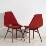 Wooden chairs with burgundy red fabric, circa 1950
