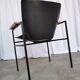 Fauteuil lounge vintage Niko Kralj : cuir skaï noir et accoudoirs en bois
