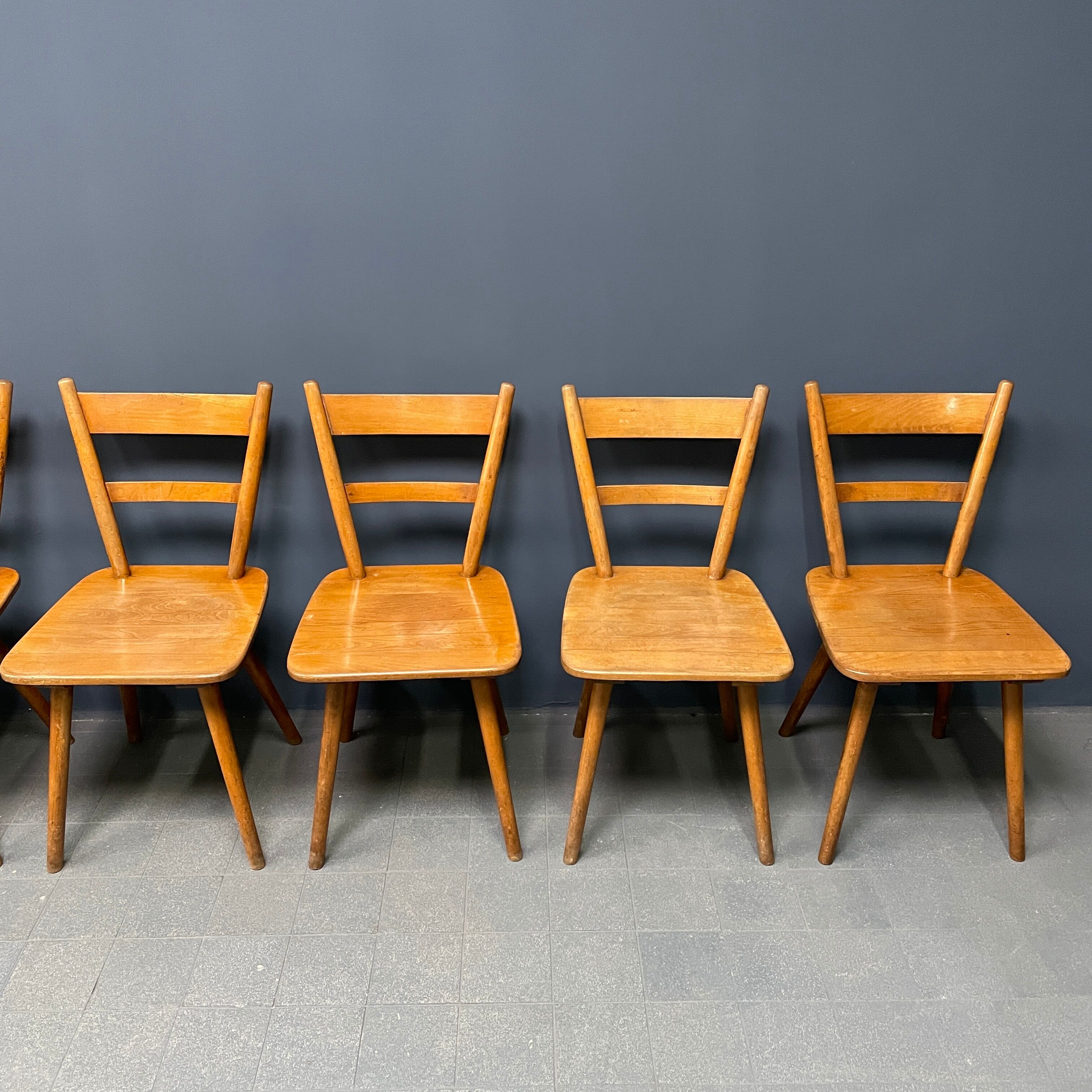 Set of eight german stick chairs from the 1950