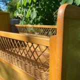 Vintage wooden and rattan baby cot from the 1960s.