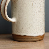 Enamelled sandstone milk jar, signed