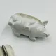 Vintage mustard pot in porcelain shaped like a pig.