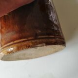 Old bottle in varnished ground.