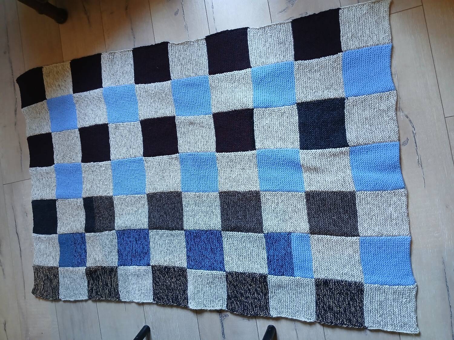 Hand knitted patchwork plaid