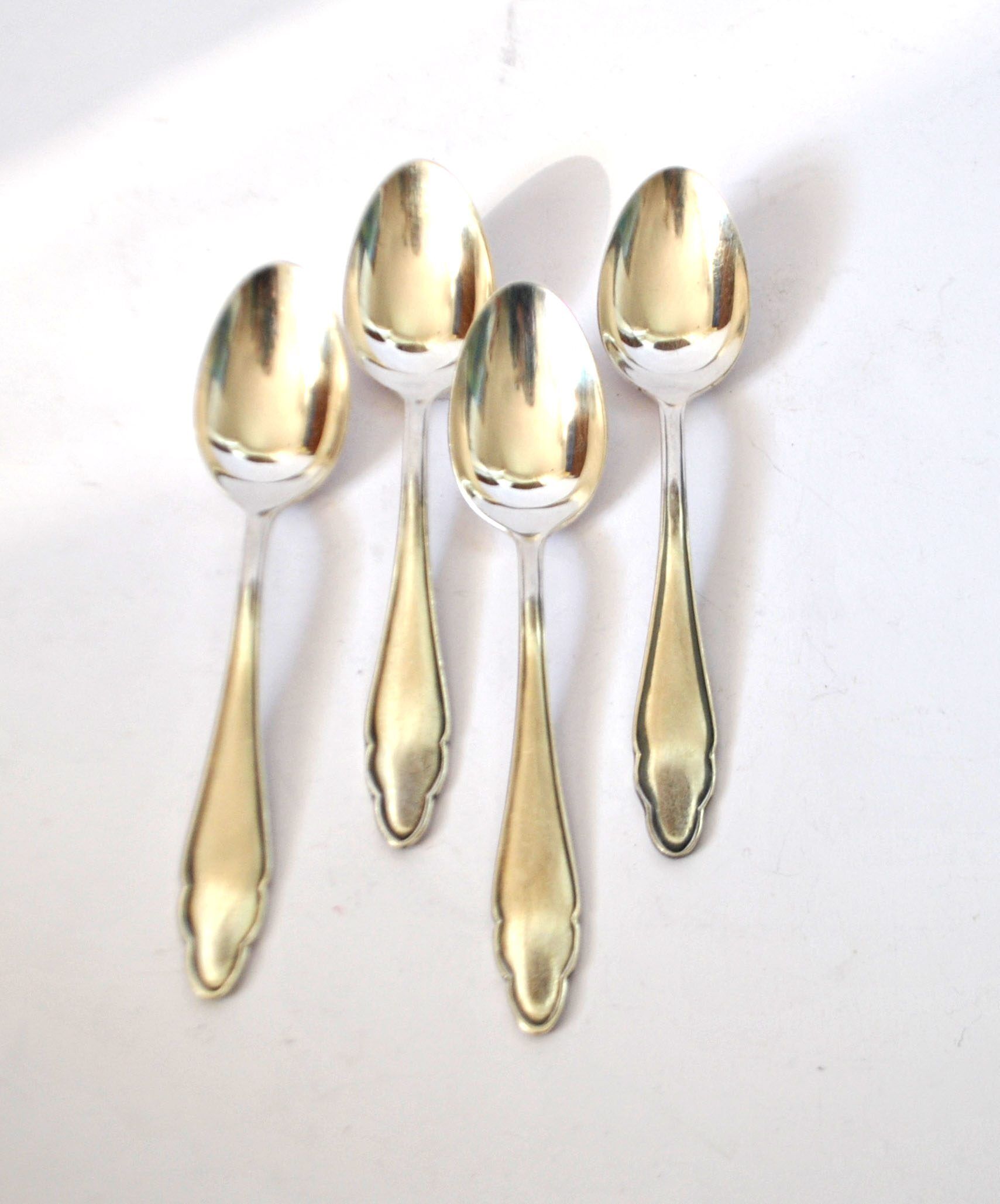 DEETJEN set of 4 silver-plated dessert spoons with a modernist scalloped design.
