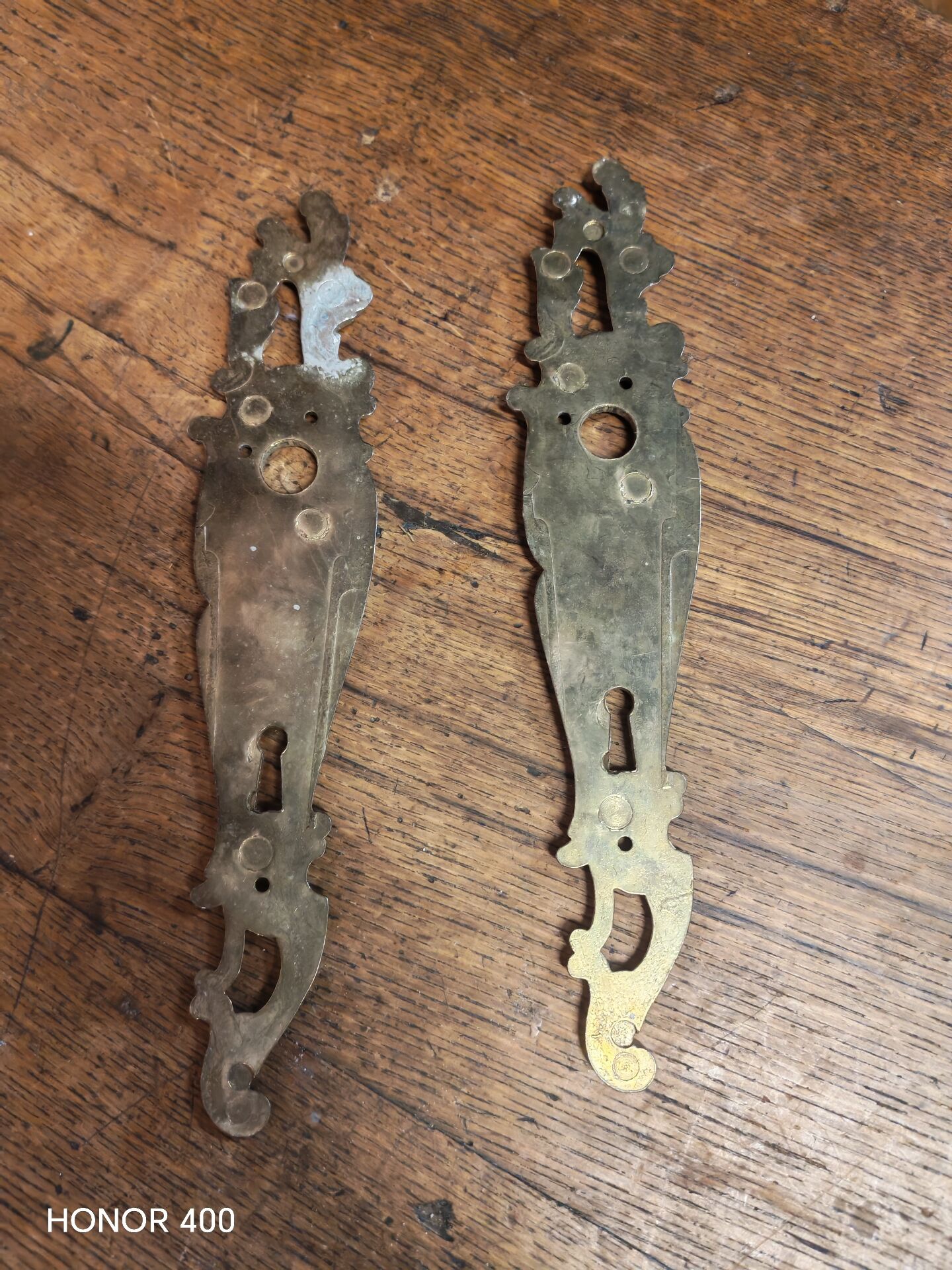 Pair of solid brass cleanliness plates in Louis XV rococo style.
