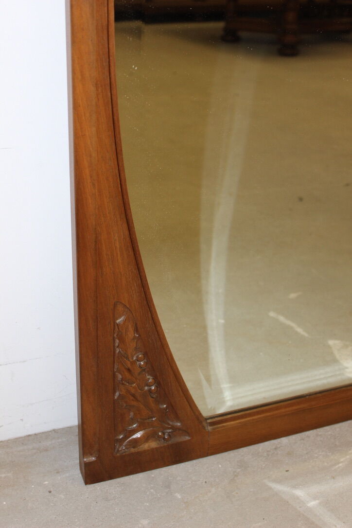 Art Nouveau walnut mirror decorated with holly leaves circa 1900 105x171cm