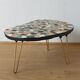 Unusual coffee table on three legs