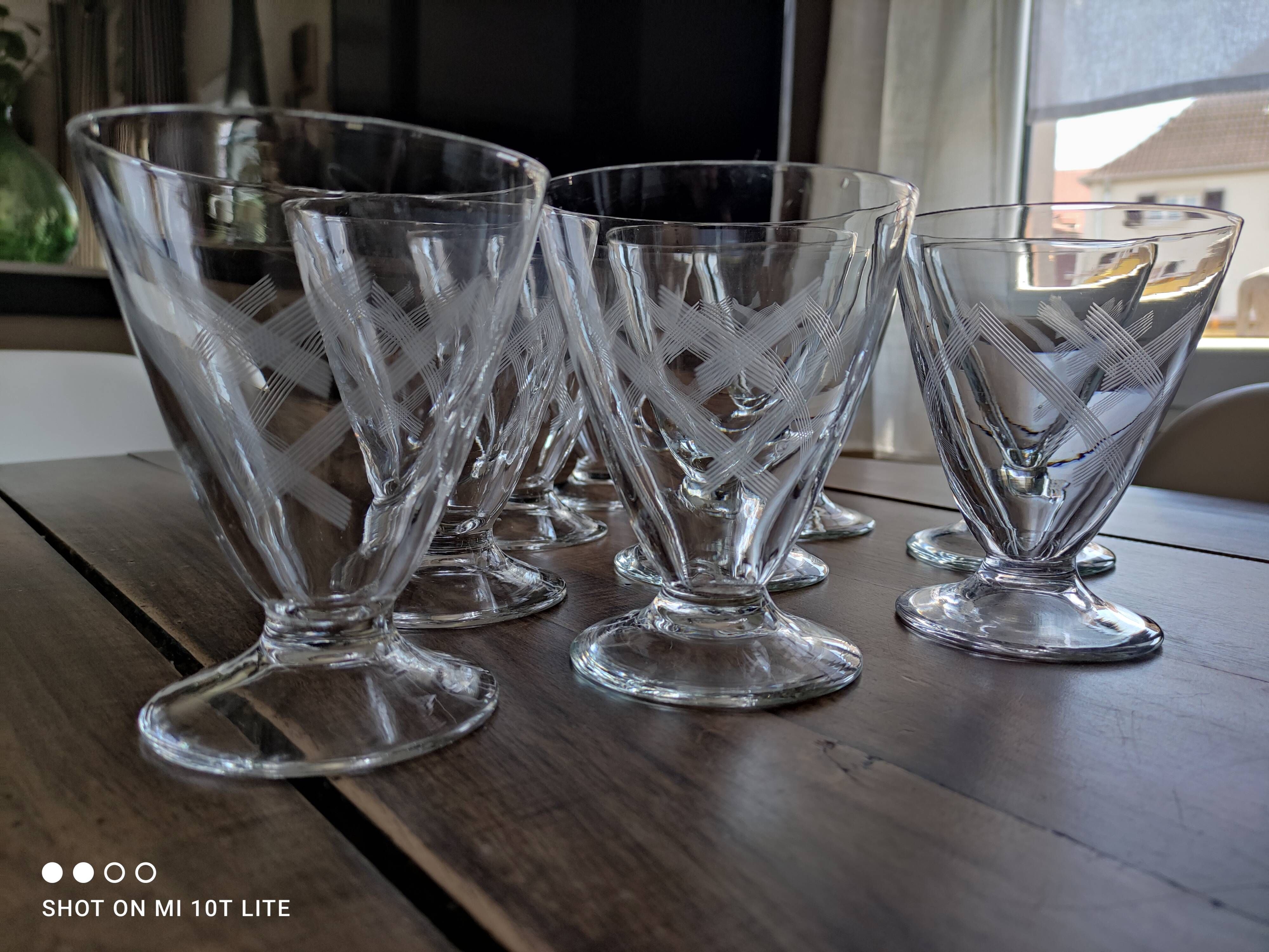 Set of 9 conical glasses on pedestal in antique chiseled glass crosses