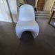 10 white chairs in the style of Verner Panton