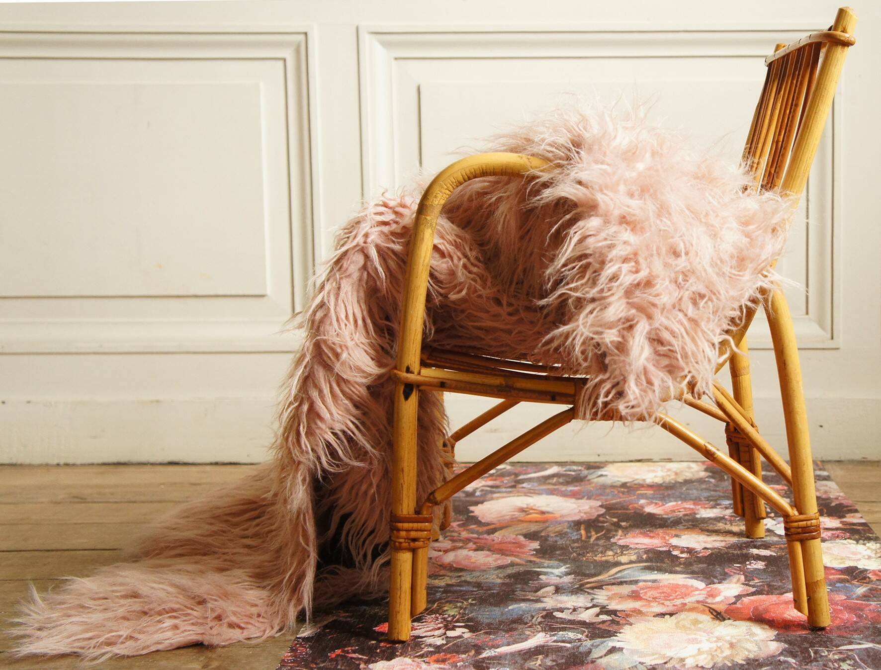 Children's rattan armchair & its old pink skin