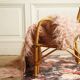 Children's rattan armchair & its old pink skin
