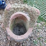 Medicis stone planters with old tree trunk decor