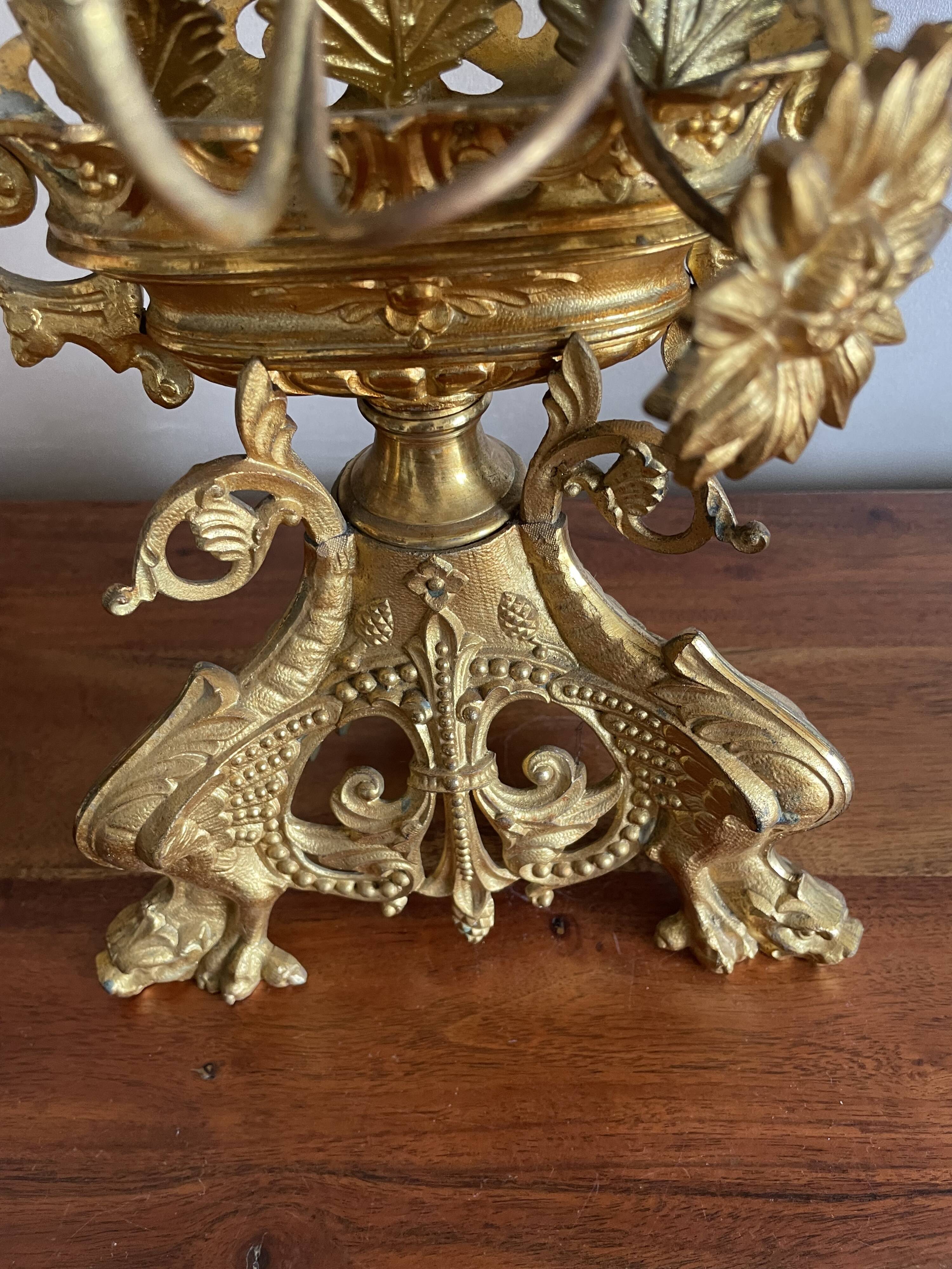 Brass church candelabra with fleur-de-lys
