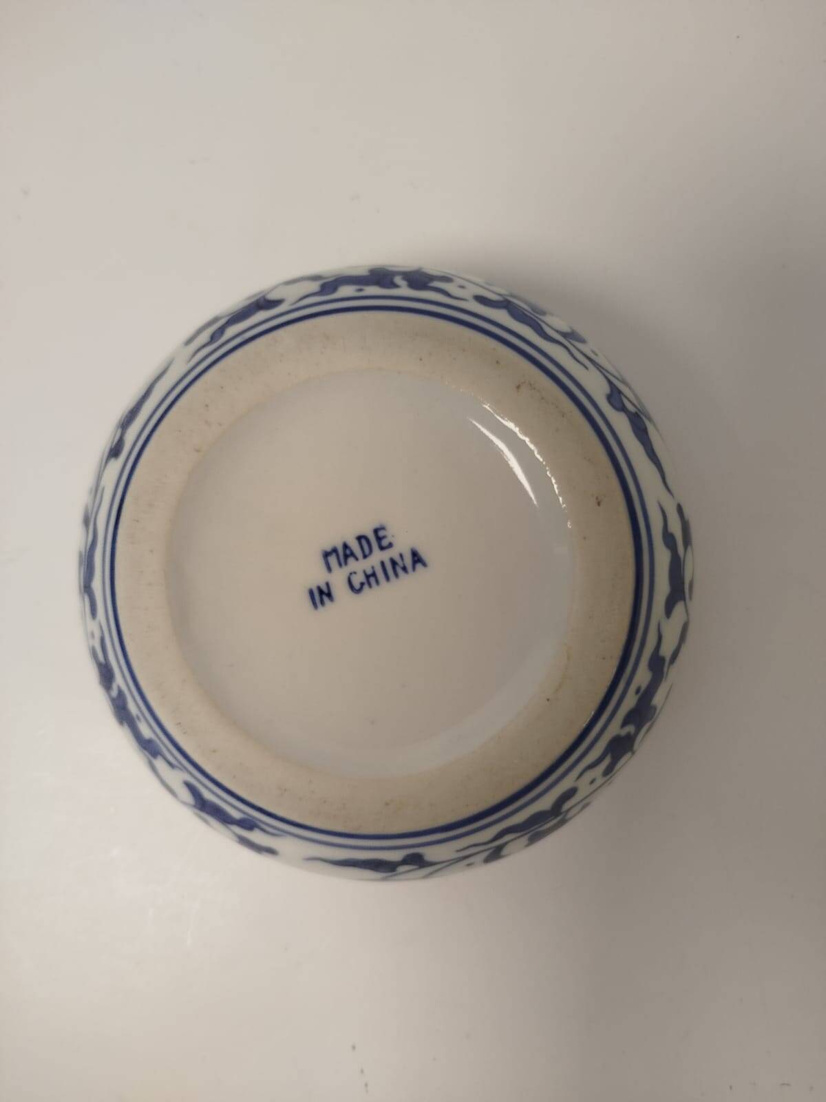 Small round Chinese-style porcelain pot with blue and white decoration