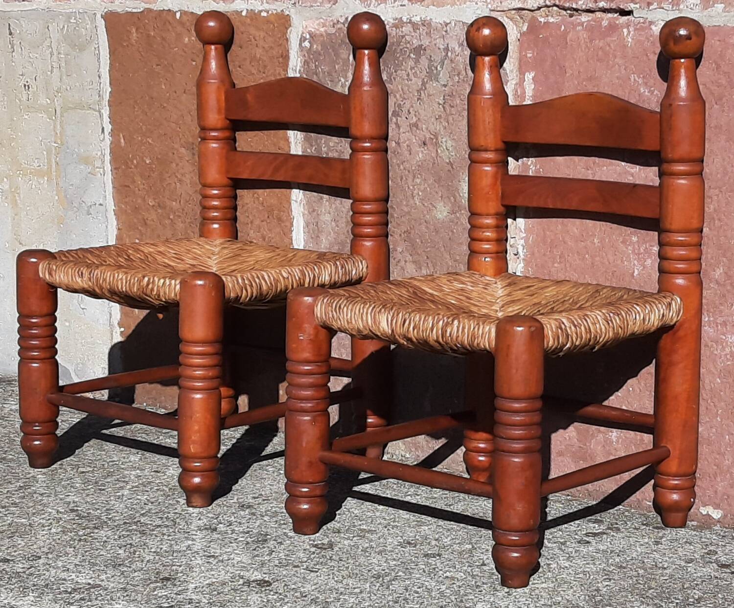 Pair of low armchairs by the fireplace. (Straw seat)