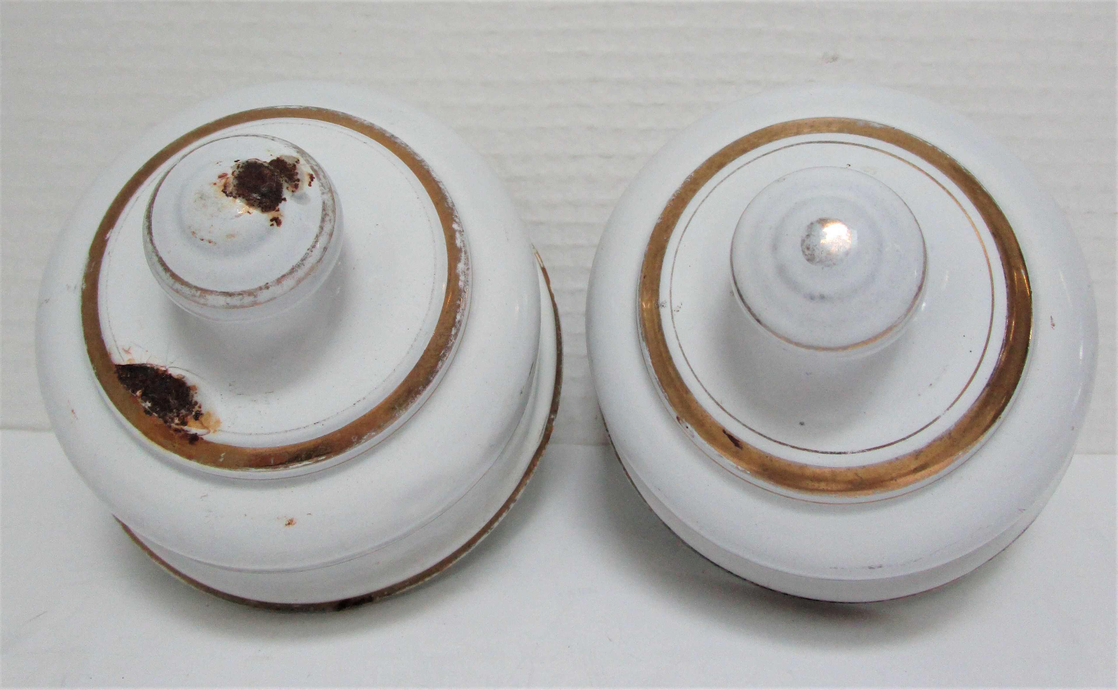 Four white enamelled metal cheese bells early twentieth century