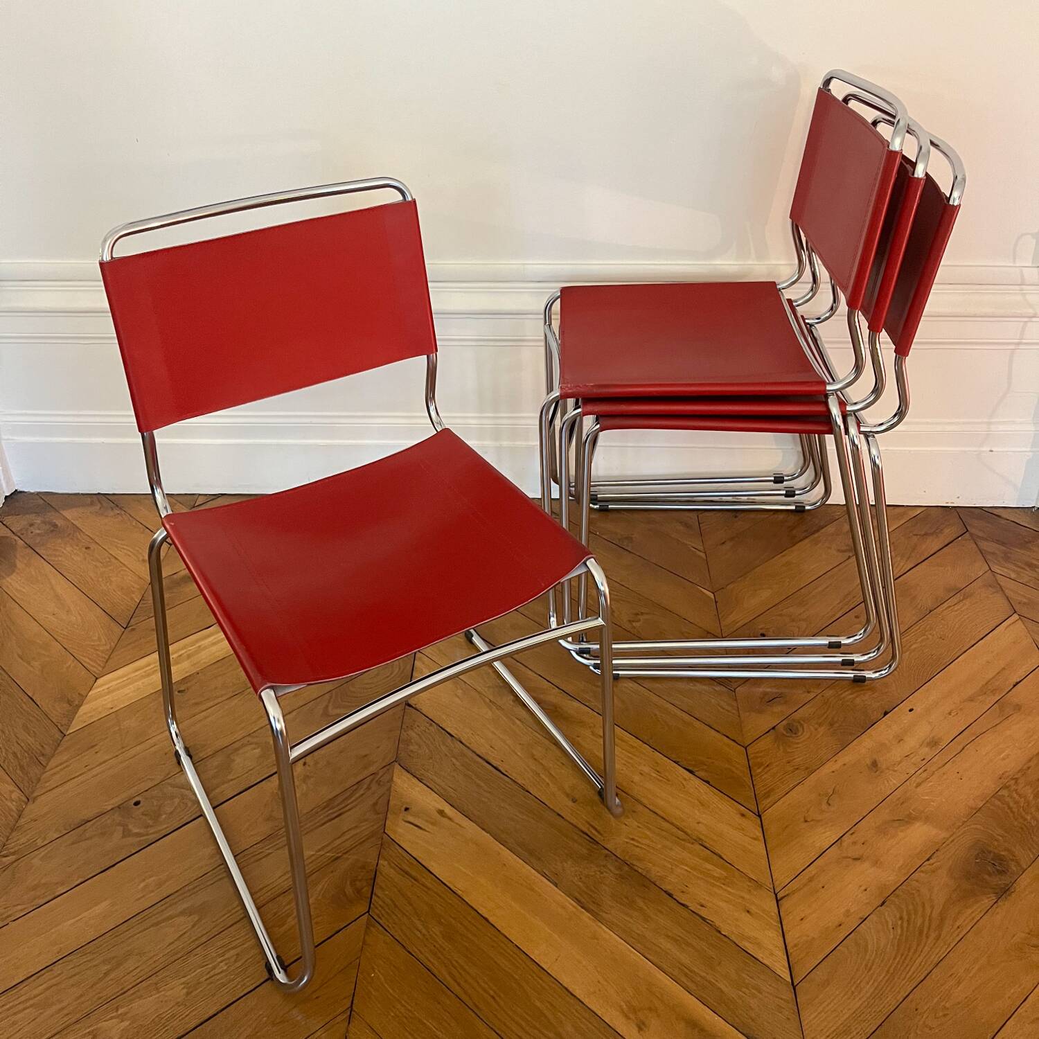 Set of 4 chairs in red leather and chrome tubular metal