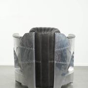 Cow leather aviator design armchair finished with aluminium and rivets