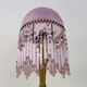 Table lamp, bedside lamp, speckled pink globe and glass and wood beads. Year 60
