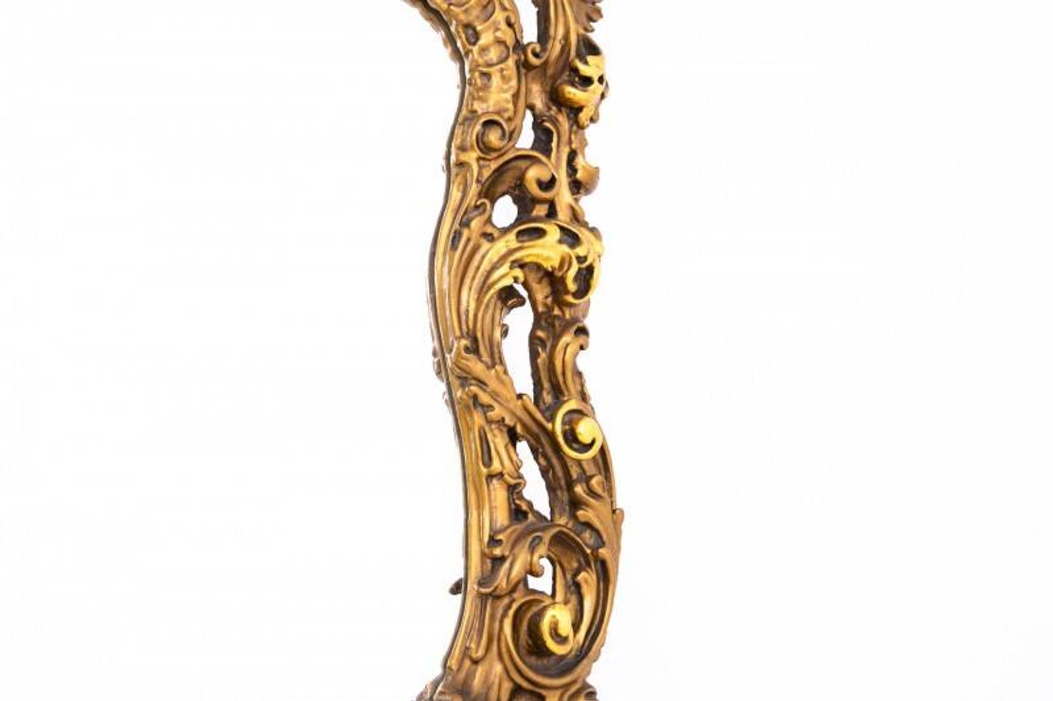 A large mirror in a gold frame, Italy, first half of the 20th century.