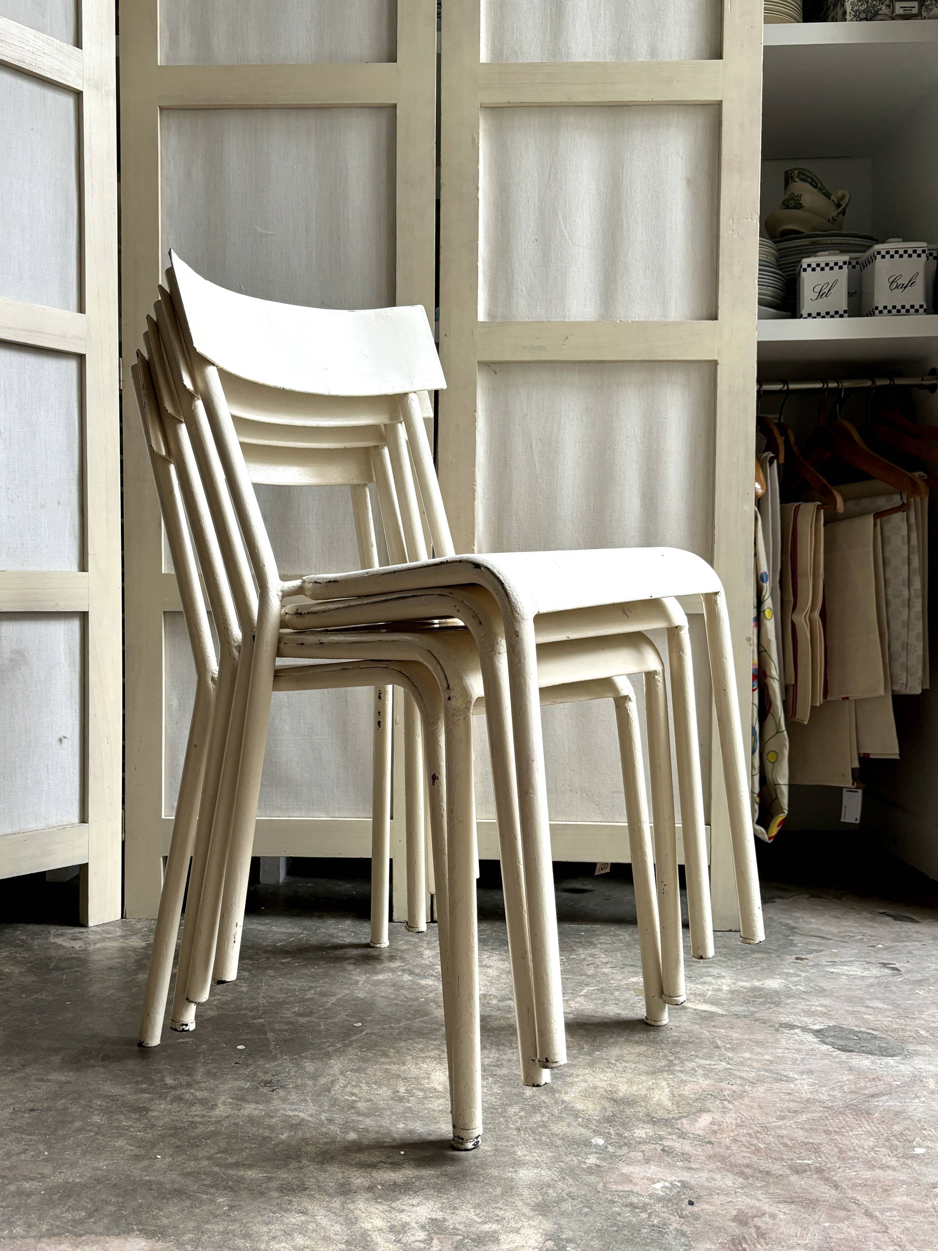 4 beige metal garden chairs