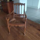 antique cherry and straw armchair with cathedral back