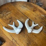 Pair of plaster swallows