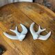 Pair of plaster swallows