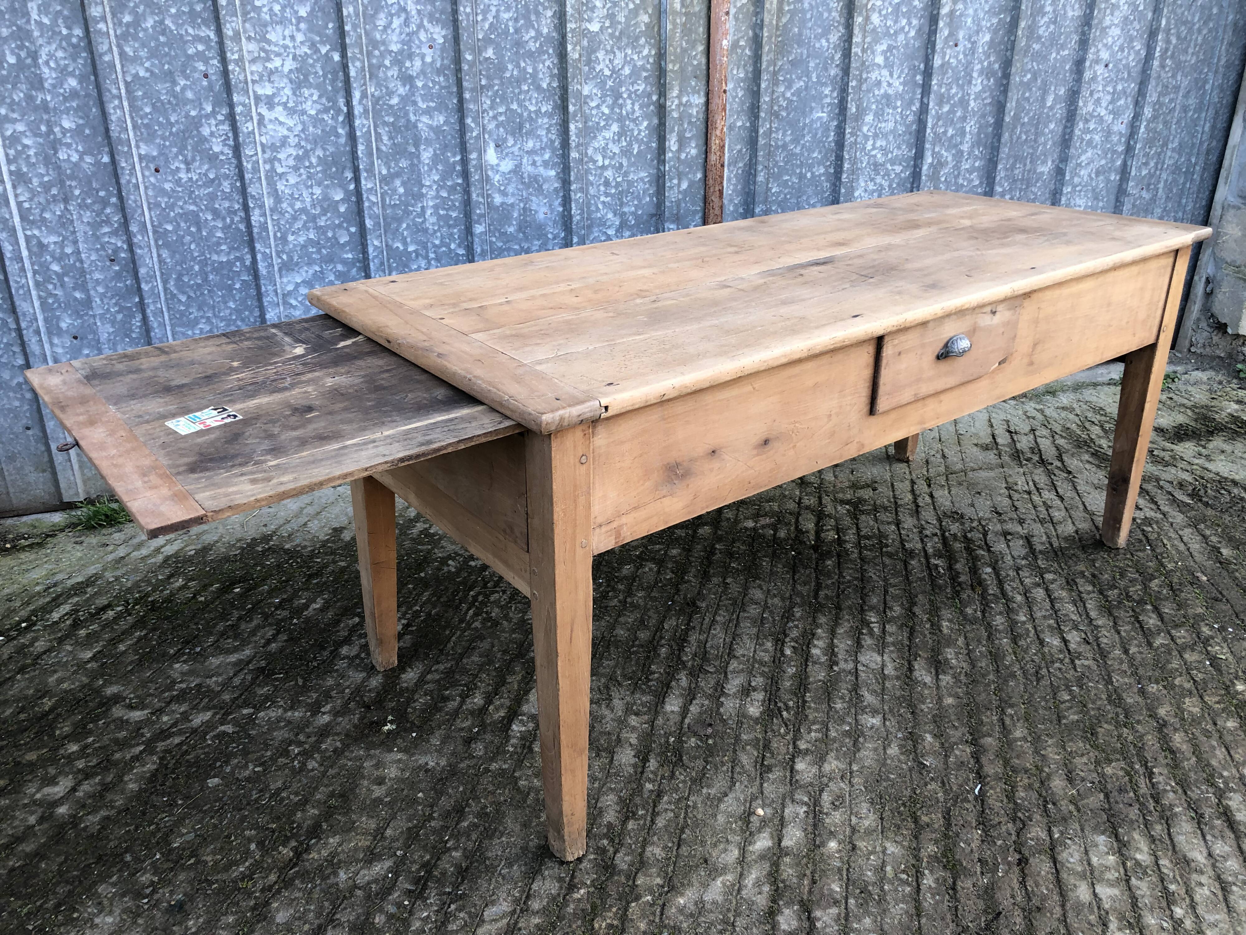 Antique solid cherry farmhouse table with 3 drawers and 1 pull out.