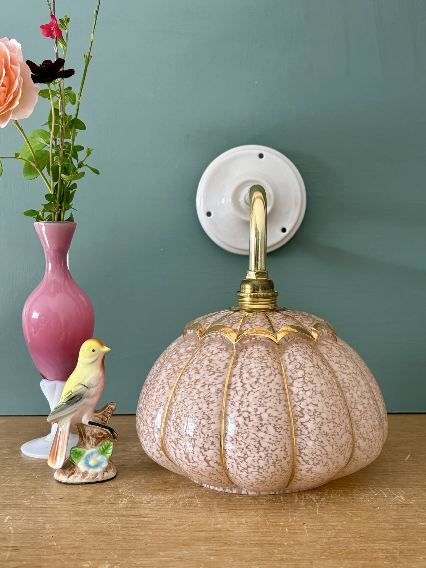 Vintage glass wall light with a pink and gold Clichy globe.