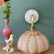 Vintage glass wall light with a pink and gold Clichy globe.