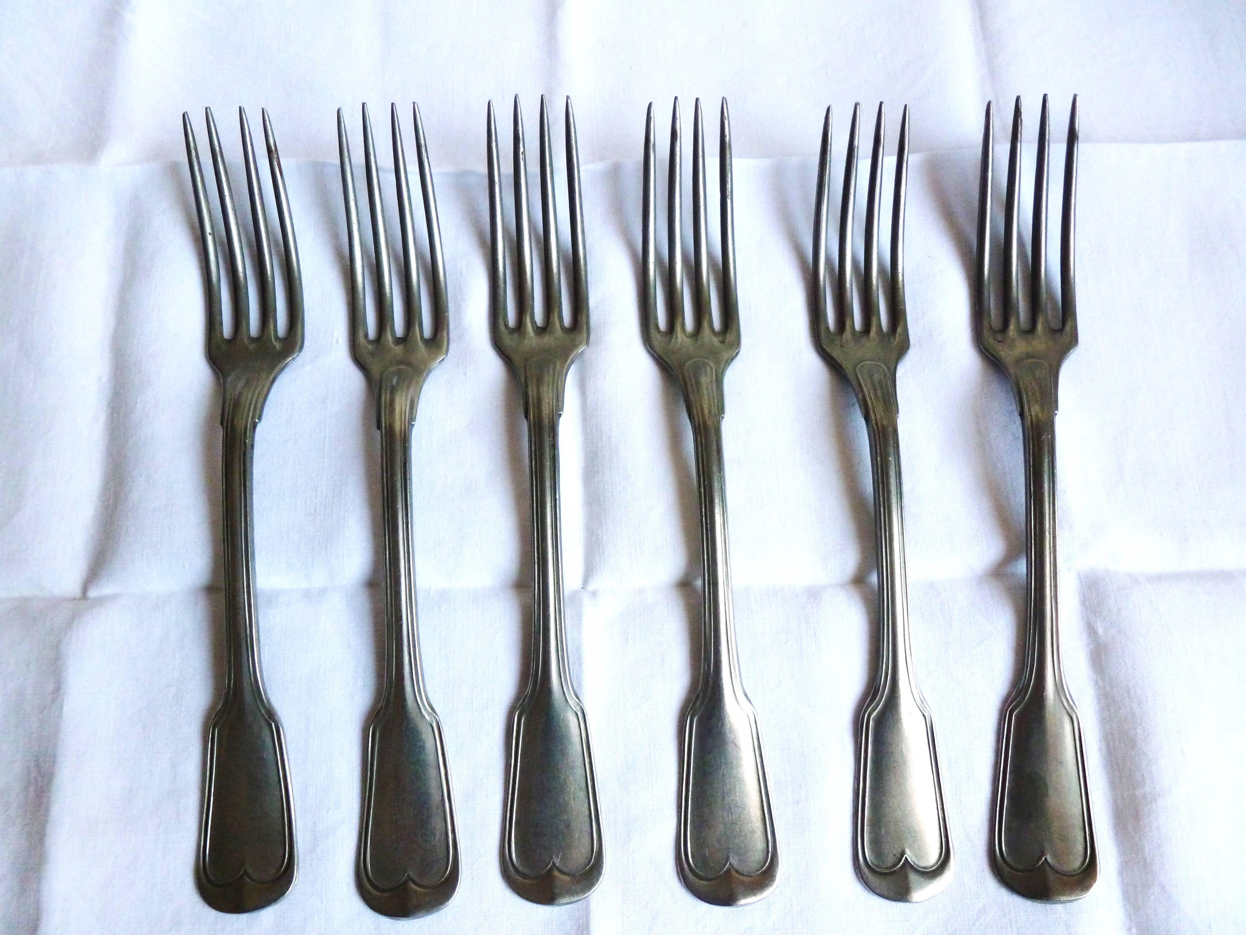 Art Deco cutlery, spoons, forks and table knives.